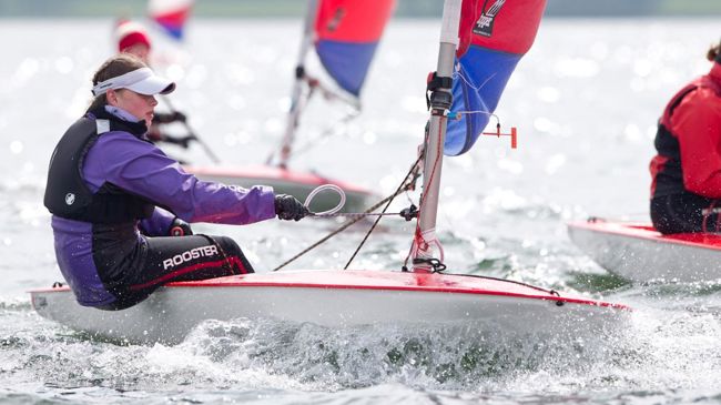 close up of young woman sailing on a dinghy