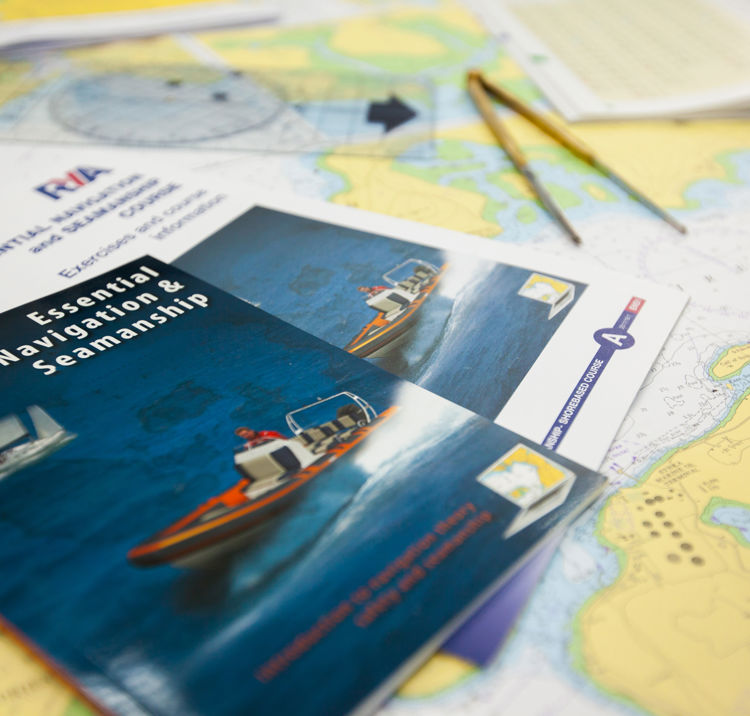 Training resources, books and charts laid out on a desk