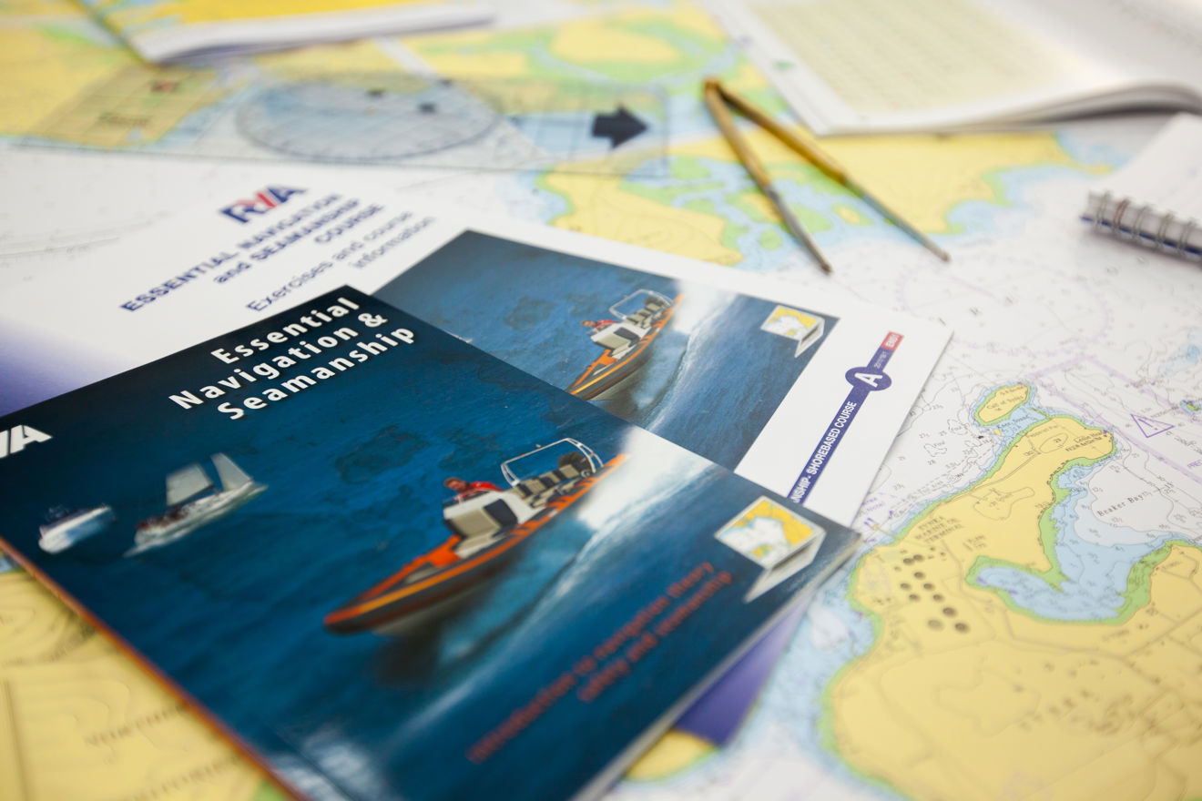 Training resources, books and charts laid out on a desk