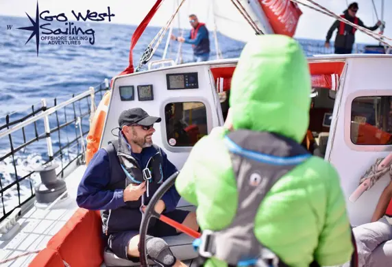 People on a yacht enjoying a offshore sailing adventure with Go West Sailing