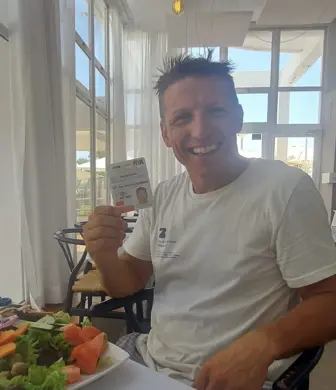 A man celebrating getting his licence