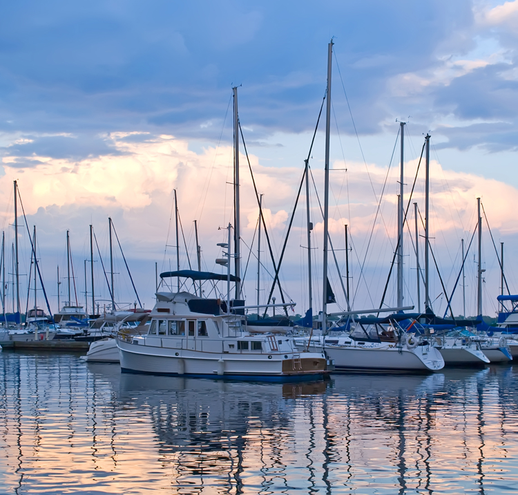Boats and yachts moored in harbour