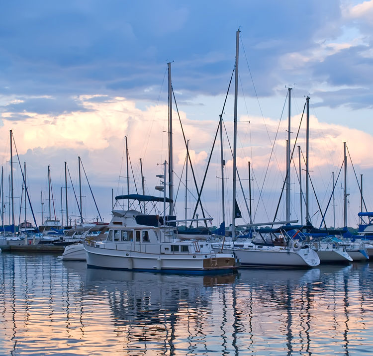 Boats and yachts moored in harbour