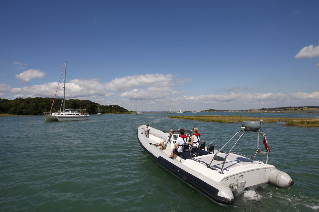 Powerboat and yacht travelling in familiar waters