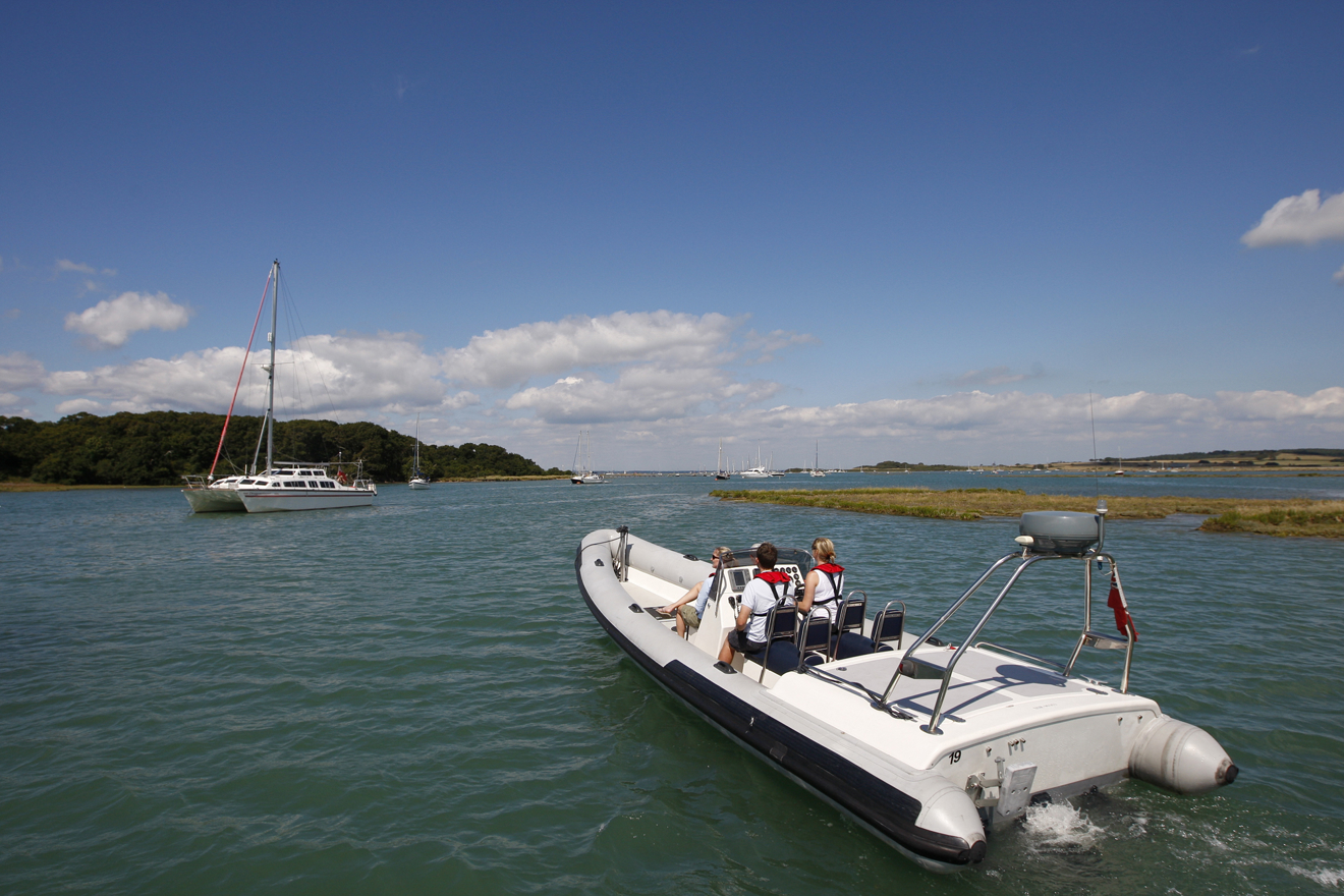 Powerboat and yacht travelling in familiar waters