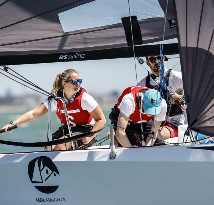 Young sailors navigating their craft together 