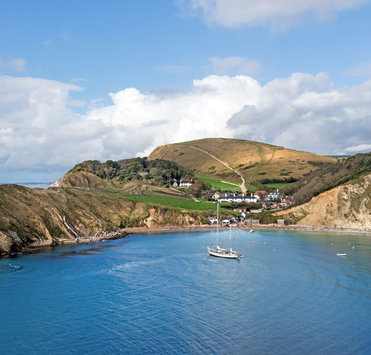 A boat sailing along a cove