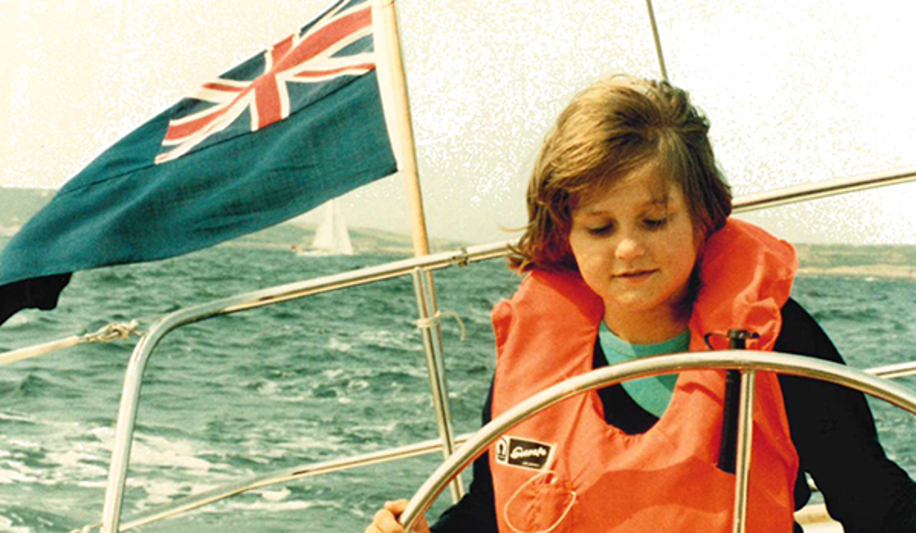 Old photo of Justine Bowman as a young girl sailing a yacht