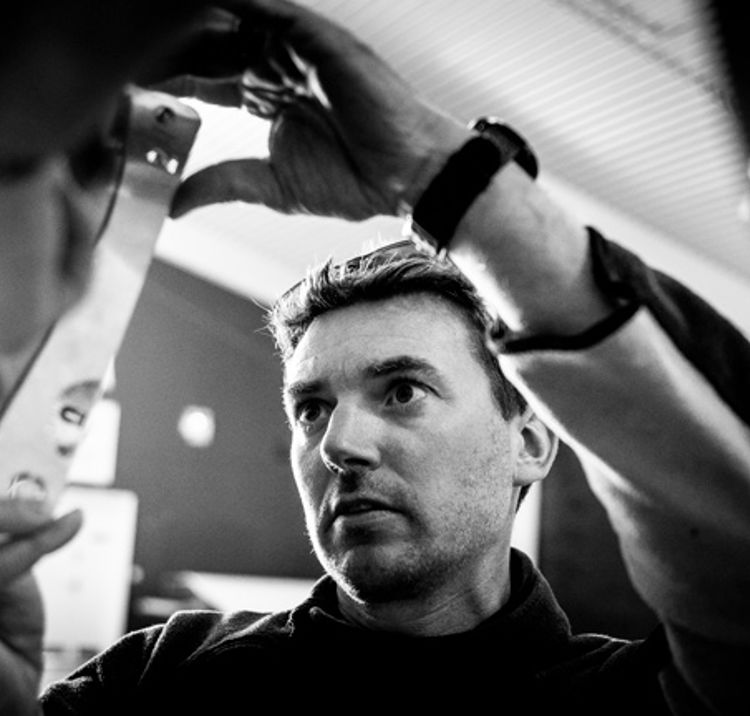 	AN image of a person measuring the equipment using a scale