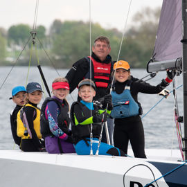 An image of Young Sailors sailing on the boat with a guide at the ET 2023