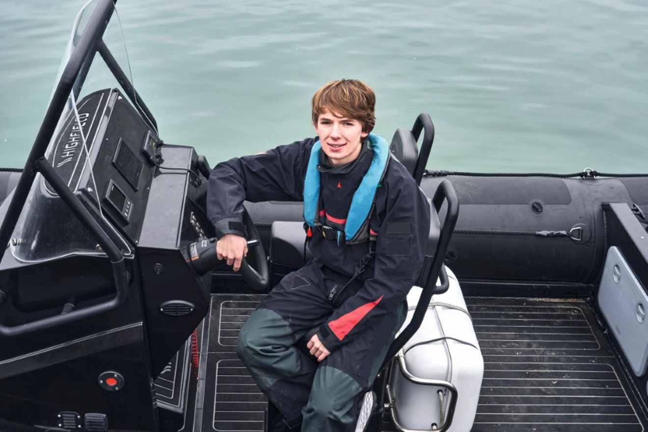 An image of Harry Besley sitting on a boat
