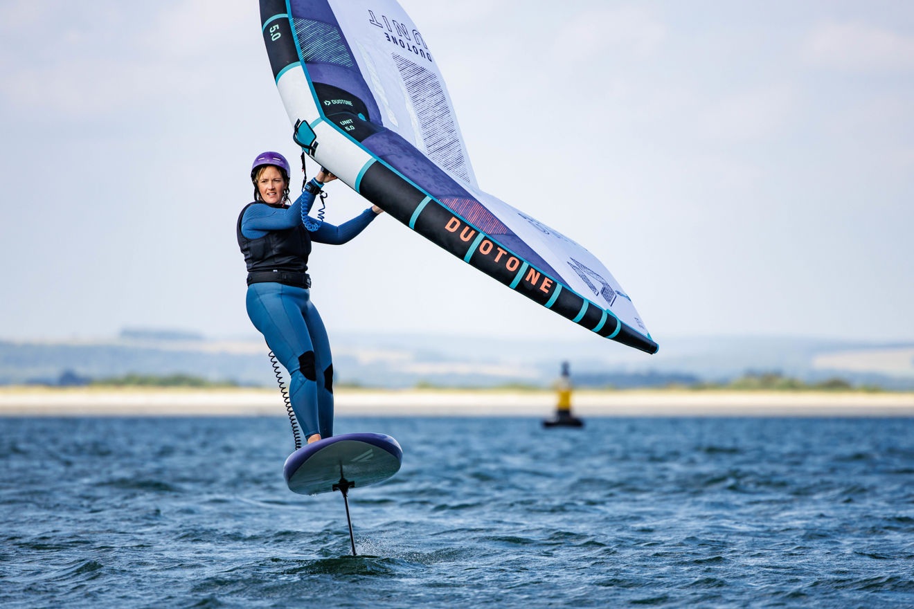 An image of a wind surfer wearing a wing leash