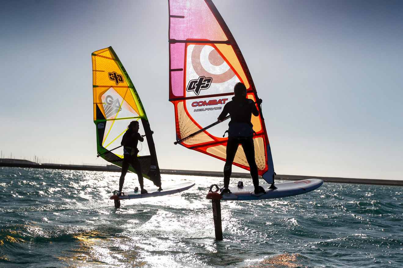 Two people wing surfing