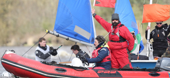 	An umpire displaying a red flag to indicate a penalty