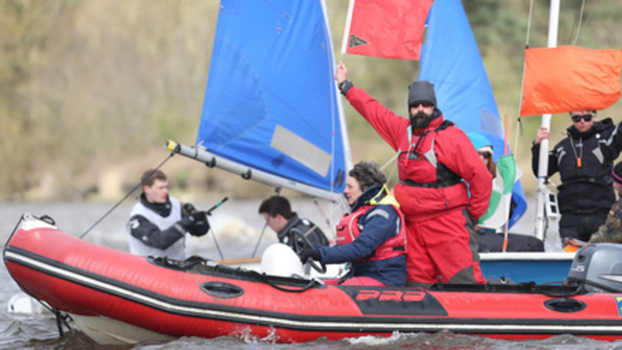 	An umpire displaying a red flag to indicate a penalty