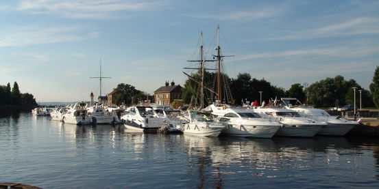 Motor Yachts On River Pontoon