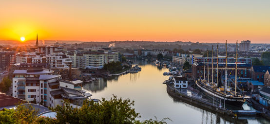 An aerial view of the Bristol harbour with a beautiful sunrise