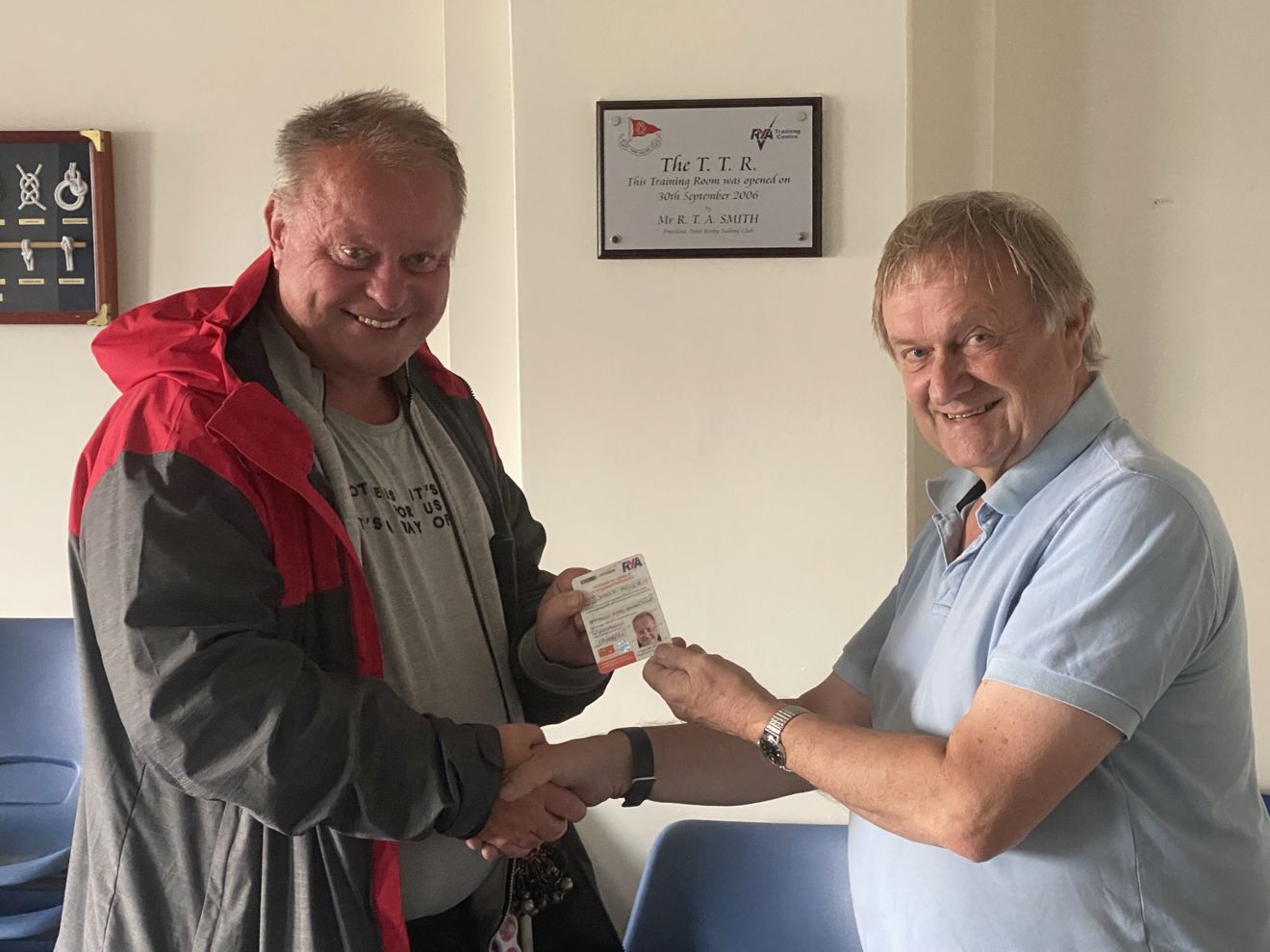Dave kelly being presented with his certificate by club president Mr Peter Bramley