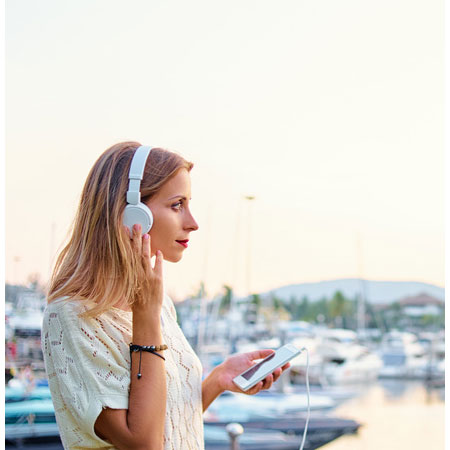 Woman wearing headphones listening to an audiobook
