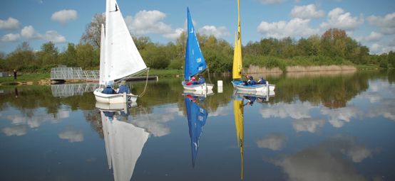 Long shot of Testwood Lake's boats on water 