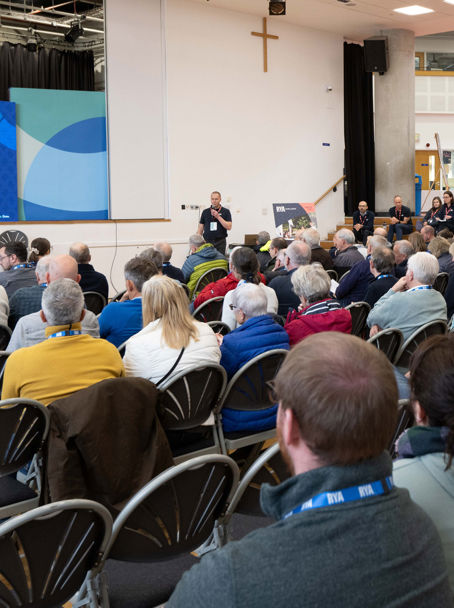 Mid shot of audience at a Connected Conference watching presentation