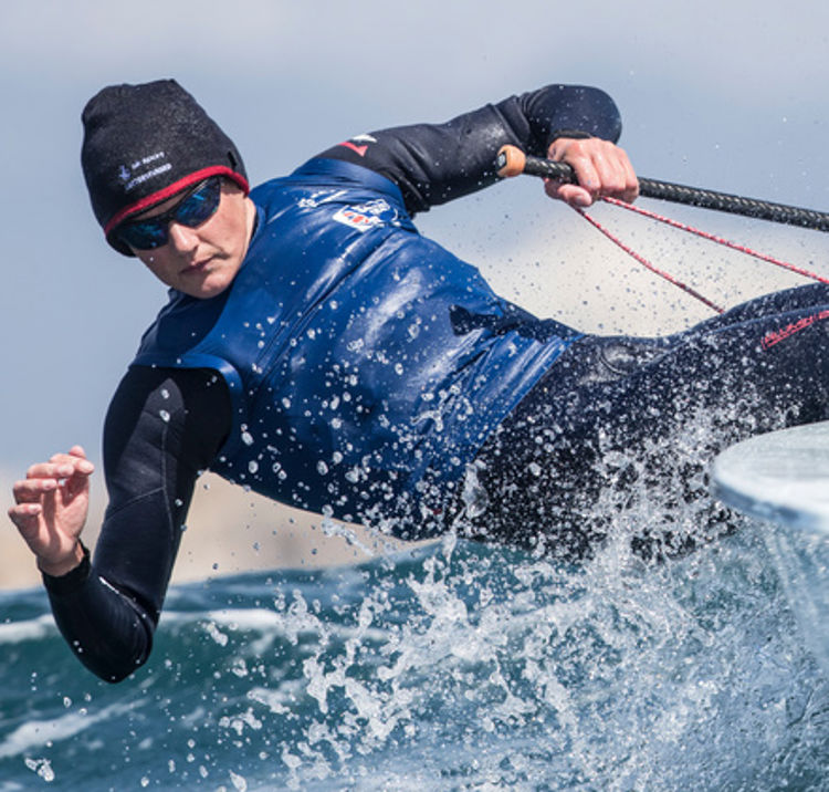 Action shot of sailor in keelboat