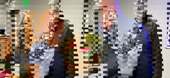 Susan and Gavin at the AGM holding flowers