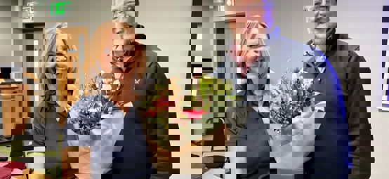 Susan and Gavin at the AGM holding flowers