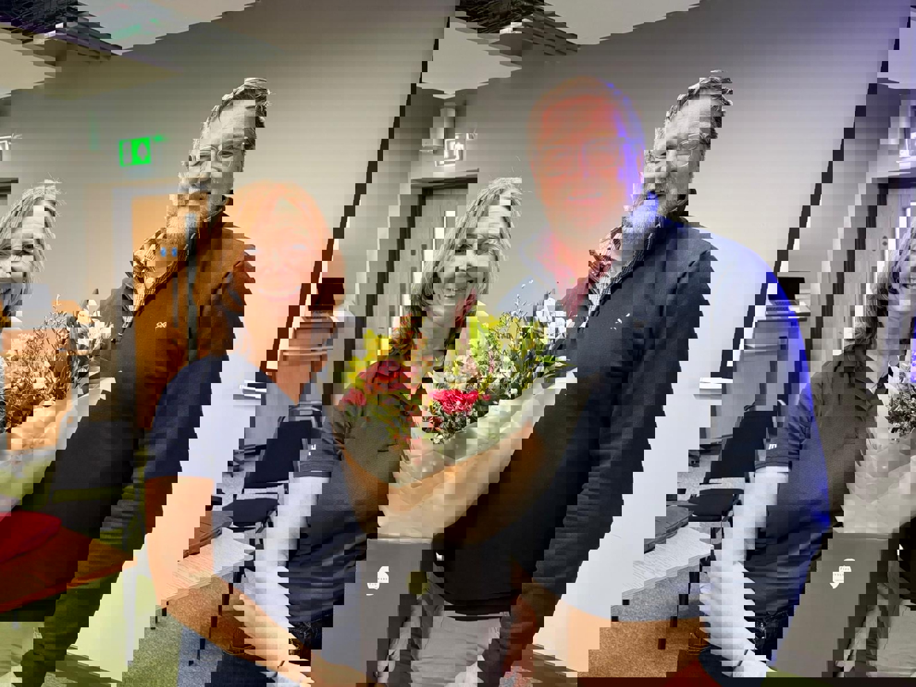 Susan and Gavin at the AGM holding flowers