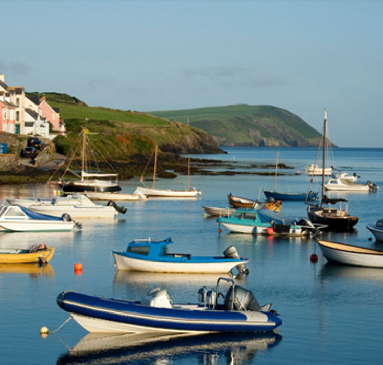 Boats in harbour on a still sunny day