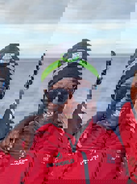 Smiling women with two children who are also smiling