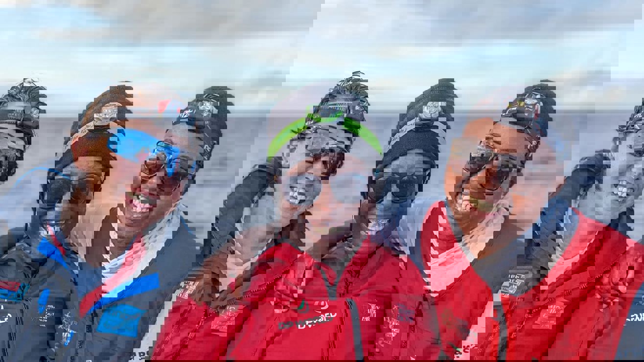 Smiling women with two children who are also smiling