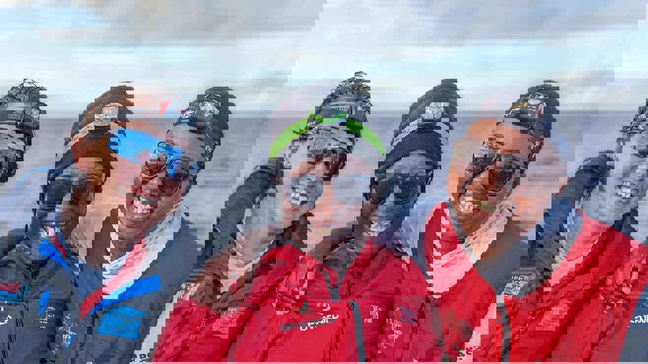 Smiling women with two children who are also smiling