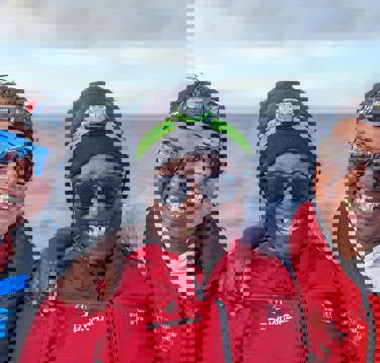 Smiling women with two children who are also smiling