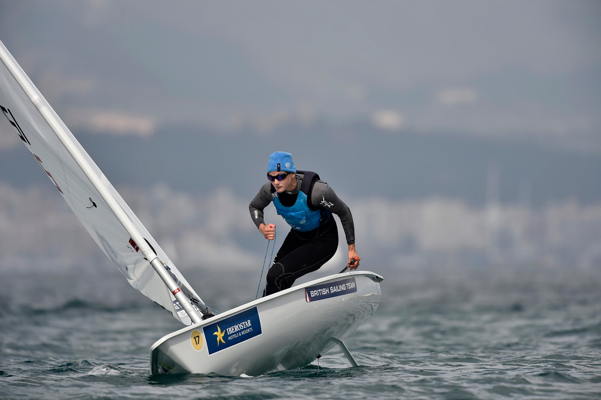 man sailing a single handed dinghy 