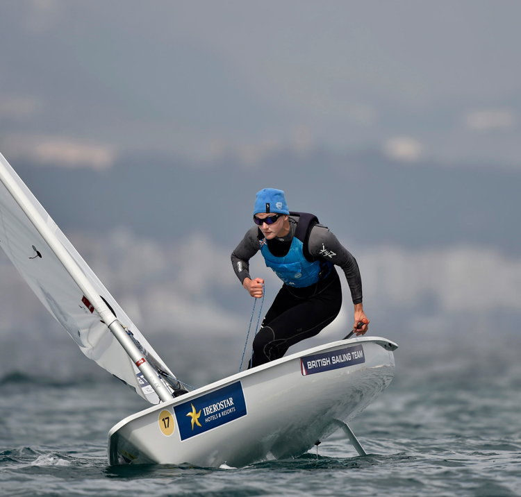 man sailing a single handed dinghy