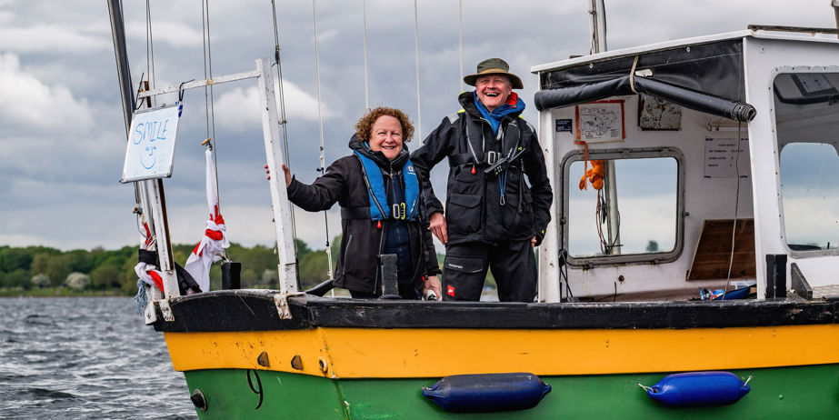 Brilliant basics - couple onboard a boat smiling