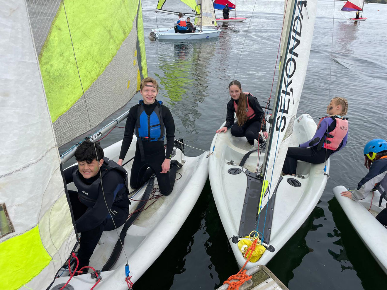 Children smiling on dinghies at Northampton Sailing Club