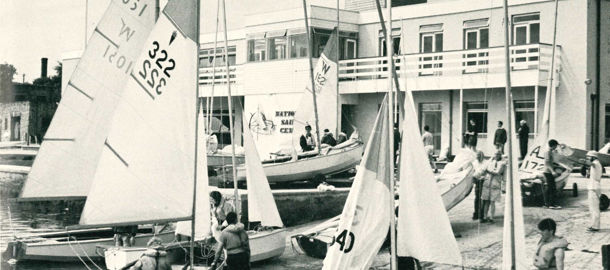 sailors preparing to set out on the water from their club 