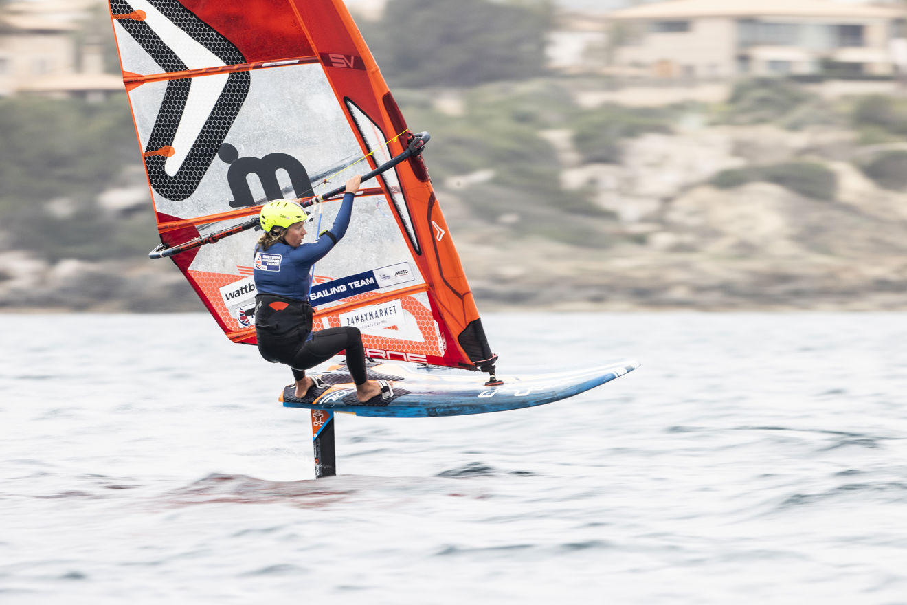 Woman windsurfing on the water