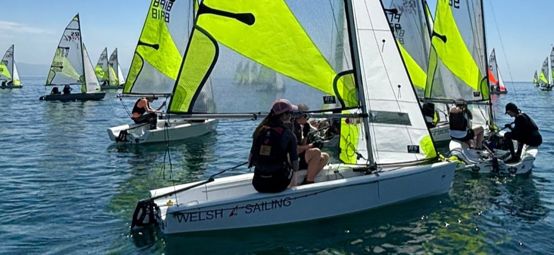 A Welsh Sailing brand new RS Feva in action on a sunny day at the class nationals at Pwllheli in May 2026. 