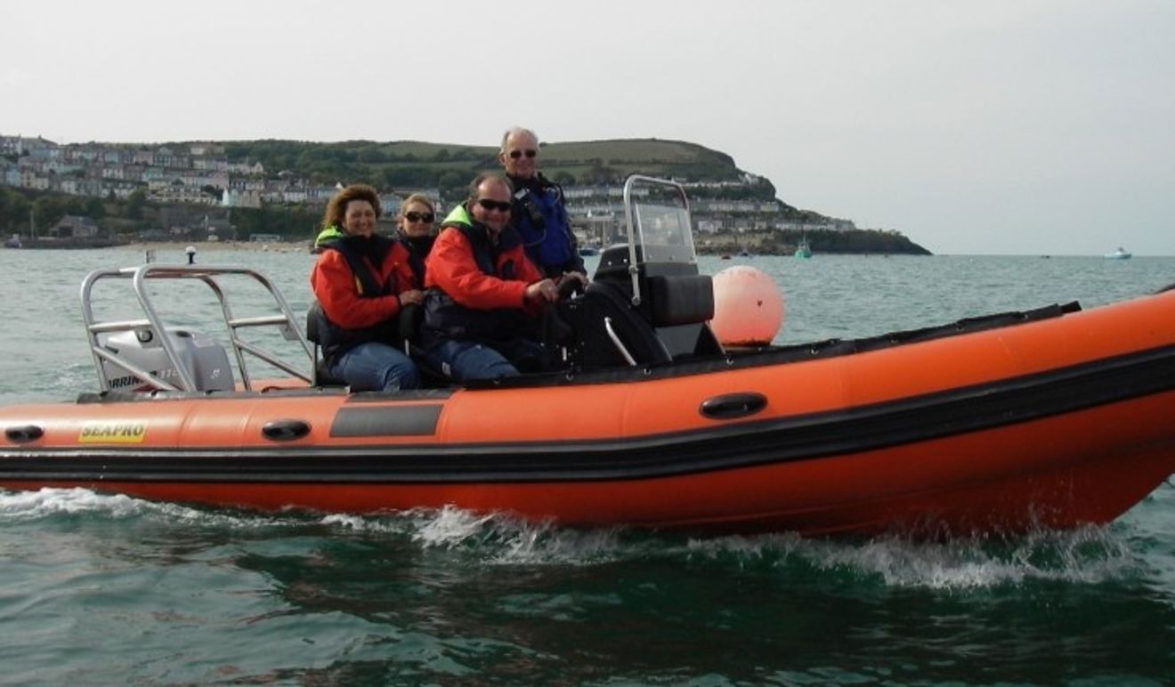 Stephen Wood aboard a powerboat with three other people at Cardigan Bay Watersports.